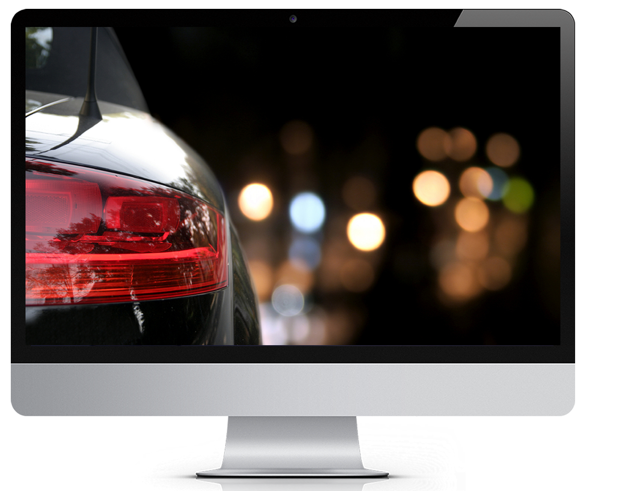 A computer monitor with a the tail light of a car on a city night



































































Computer Monitor white background - with a photo of a tail light on a city night super imposed on the monitor

