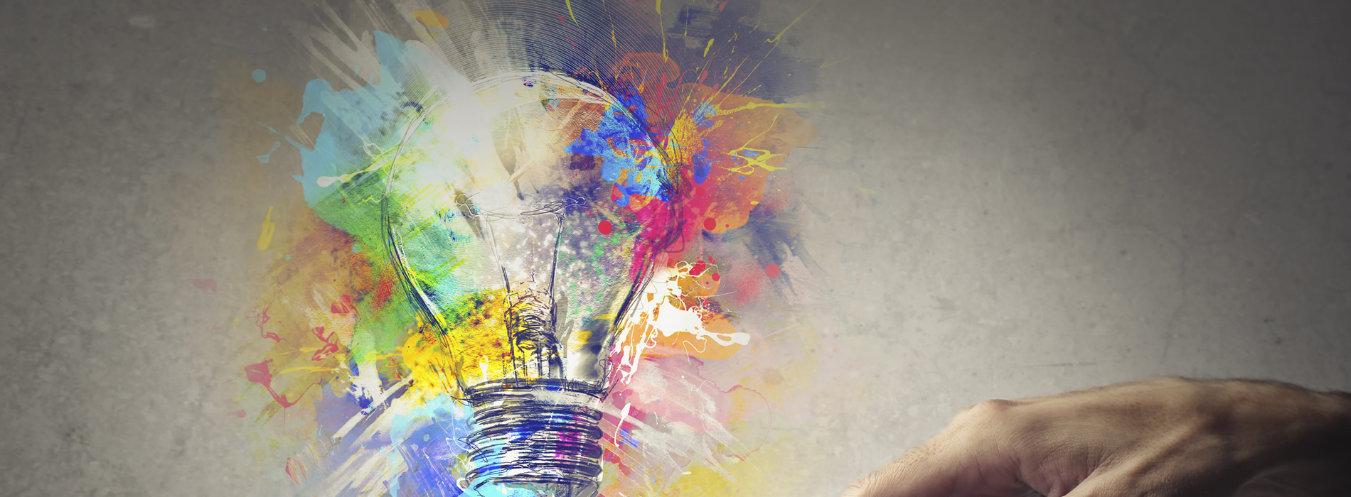 an artist creation of a colorful light bulb exploding with ideas 